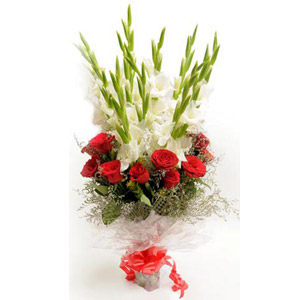 Gladiolus with red roses in a bouquet