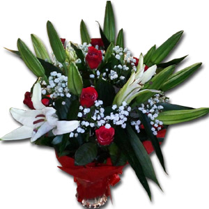 White lily W/ Red roses in a vase